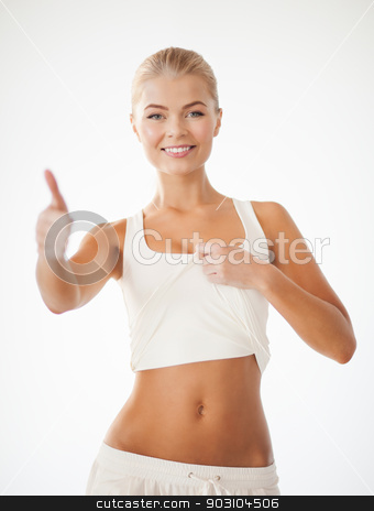 To use this stock image in your creative project, please select the size you need over to the right and click the "Add to Cart" button.
Your downloaded image will come with the Cutcaster watermark removed so don’t worry about the watermark you see on this page. sporty woman showing thumbs up stock photo, beautiful sporty woman showing thumbs up and her abs by Syda Productions