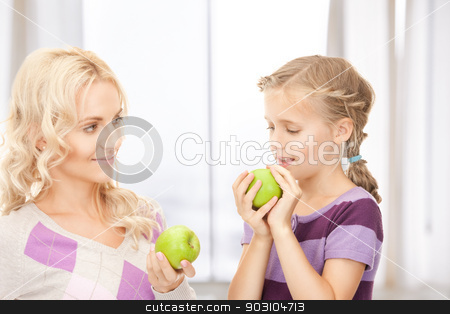 To use this stock image in your creative project, please select the size you need over to the right and click the "Add to Cart" button.
Your downloaded image will come with the Cutcaster watermark removed so don’t worry about the watermark you see on this page. mother and little girl with green apple stock photo, picture of mother and little girl with green apple by Syda Productions