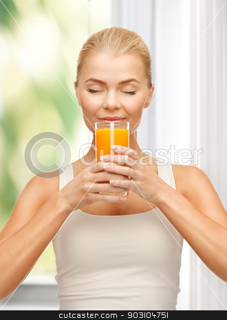 To use this stock image in your creative project, please select the size you need over to the right and click the "Add to Cart" button.
Your downloaded image will come with the Cutcaster watermark removed so don’t worry about the watermark you see on this page. young woman drinking orange juice stock photo, picture of young woman drinking orange juice by Syda Productions