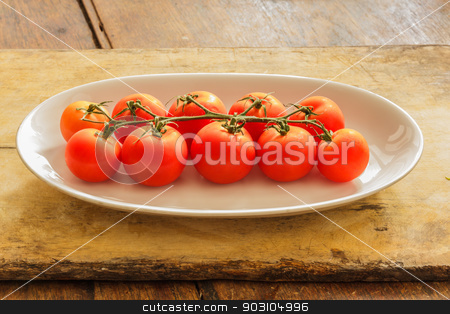 To use this stock image in your creative project, please select the size you need over to the right and click the "Add to Cart" button.
Your downloaded image will come with the Cutcaster watermark removed so don’t worry about the watermark you see on this page. Cherry tomatoes in a dish on a table made of wood. stock photo, Cherry tomatoes on plate on wooden table in the kitchen. by SONGSAK AROMYIM