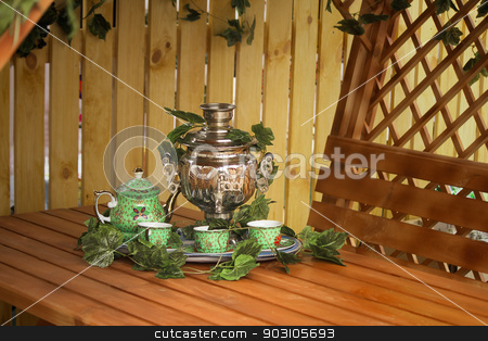 To use this stock image in your creative project, please select the size you need over to the right and click the "Add to Cart" button.
Your downloaded image will come with the Cutcaster watermark removed so don’t worry about the watermark you see on this page. National Russian tradition to drink tea from a samovar. stock photo, Beautiful large samovar, cups and a kettle are standing on a table in expectation of the guests.
by Georgina198