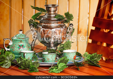 To use this stock image in your creative project, please select the size you need over to the right and click the "Add to Cart" button.
Your downloaded image will come with the Cutcaster watermark removed so don’t worry about the watermark you see on this page. National Russian tradition to drink tea from a samovar. stock photo, Beautiful large samovar, cups and a kettle are standing on a table in expectation of the guests.
by Georgina198