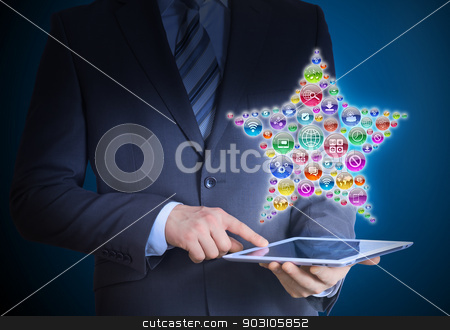 To use this stock image in your creative project, please select the size you need over to the right and click the "Add to Cart" button.
Your downloaded image will come with the Cutcaster watermark removed so don’t worry about the watermark you see on this page. Businessman holding tablet in his hands stock photo, Businessman in a suit holding a tablet in his hands. Above the screen tablet application icons in the form of star by cherezoff