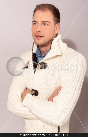 To use this stock image in your creative project, please select the size you need over to the right and click the "Add to Cart" button.
Your downloaded image will come with the Cutcaster watermark removed so don’t worry about the watermark you see on this page. Stylish handsome young man stock photo, Stylish handsome unshaven young man in a cream winter sweater standing with folded arms looking at the camera with a smile by Roland Stollner