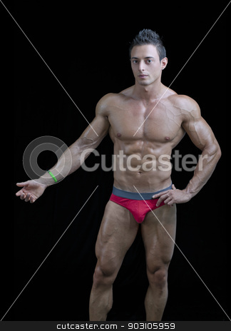 To use this stock image in your creative project, please select the size you need over to the right and click the "Add to Cart" button.
Your downloaded image will come with the Cutcaster watermark removed so don’t worry about the watermark you see on this page. Muscular young bodybuilder in relaxed pose, one arm up. stock photo, Muscular young bodybuilder in relaxed pose, one hand showing something. Isolated on black by Stefano Cavoretto