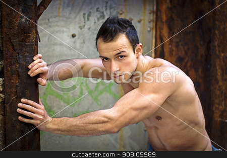 To use this stock image in your creative project, please select the size you need over to the right and click the "Add to Cart" button.
Your downloaded image will come with the Cutcaster watermark removed so don’t worry about the watermark you see on this page. Muscular young man standing, leaning against rusty metal structure stock photo, Muscular young man standing, leaning against rusty metal structure, looking at camera by Stefano Cavoretto