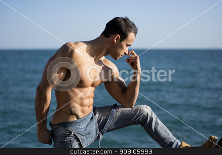 To use this stock image in your creative project, please select the size you need over to the right and click the "Add to Cart" button.
Your downloaded image will come with the Cutcaster watermark removed so don’t worry about the watermark you see on this page. Muscular shirtless young man standing by the sea or ocean stock photo, Muscular shirtless young man standing by the sea or ocean, profile view by Stefano Cavoretto