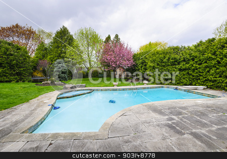 To use this stock image in your creative project, please select the size you need over to the right and click the "Add to Cart" button.
Your downloaded image will come with the Cutcaster watermark removed so don’t worry about the watermark you see on this page. Swimming pool in backyard stock photo, Backyard with outdoor inground residential private swimming pool and stone patio by Elena Elisseeva