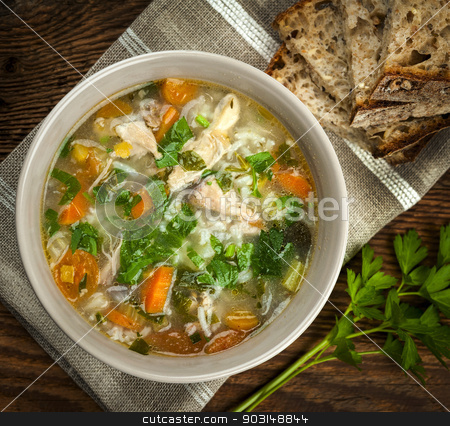 To use this stock image in your creative project, please select the size you need over to the right and click the "Add to Cart" button.
Your downloaded image will come with the Cutcaster watermark removed so don’t worry about the watermark you see on this page. Chicken soup with rice and vegetables stock photo, Chicken rice soup with vegetables in bowl and bread from above closeup by Elena Elisseeva