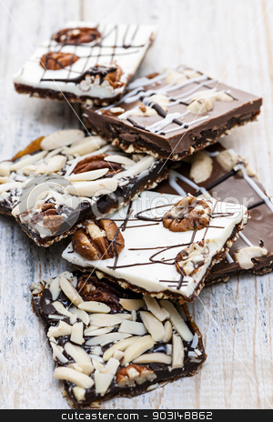 To use this stock image in your creative project, please select the size you need over to the right and click the "Add to Cart" button.
Your downloaded image will come with the Cutcaster watermark removed so don’t worry about the watermark you see on this page. Chocolate caramel bark pieces stock photo, Assorted chocolate caramel bark pieces for sweet dessert by Elena Elisseeva