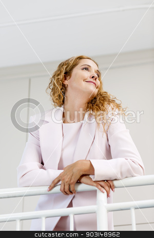 To use this stock image in your creative project, please select the size you need over to the right and click the "Add to Cart" button.
Your downloaded image will come with the Cutcaster watermark removed so don’t worry about the watermark you see on this page. Portrait of confident businesswoman in office stock photo, Profile of confident successful business woman standing in office hallway leaning on railing shot from below by Elena Elisseeva