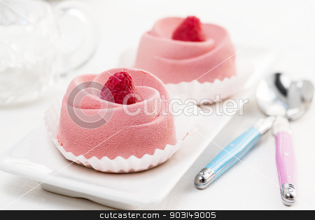 To use this stock image in your creative project, please select the size you need over to the right and click the "Add to Cart" button.
Your downloaded image will come with the Cutcaster watermark removed so don’t worry about the watermark you see on this page. Raspberry mousse dessert stock photo, Two pink raspberry mousse desserts on a plate by Elena Elisseeva