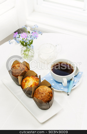 To use this stock image in your creative project, please select the size you need over to the right and click the "Add to Cart" button.
Your downloaded image will come with the Cutcaster watermark removed so don’t worry about the watermark you see on this page. Muffins and coffee for breakfast stock photo, Three muffins and cup of coffee on breakfast table in the morning by Elena Elisseeva