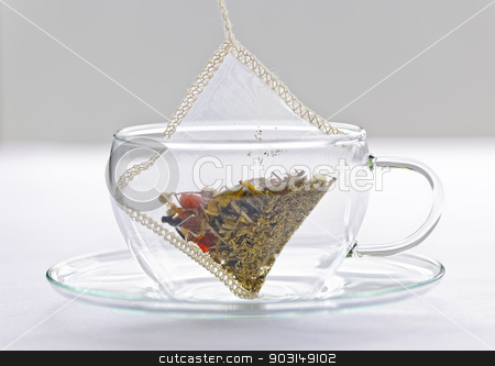 To use this stock image in your creative project, please select the size you need over to the right and click the "Add to Cart" button.
Your downloaded image will come with the Cutcaster watermark removed so don’t worry about the watermark you see on this page. Herbal tea bag in glass cup stock photo, Glass teacup with soothing herbal tea in silk bag by Elena Elisseeva