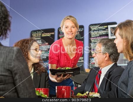To use this stock image in your creative project, please select the size you need over to the right and click the "Add to Cart" button.
Your downloaded image will come with the Cutcaster watermark removed so don’t worry about the watermark you see on this page. Woman Serving Lunch stock photo, Pretty young server bringing food to group of business people by Scott Griessel