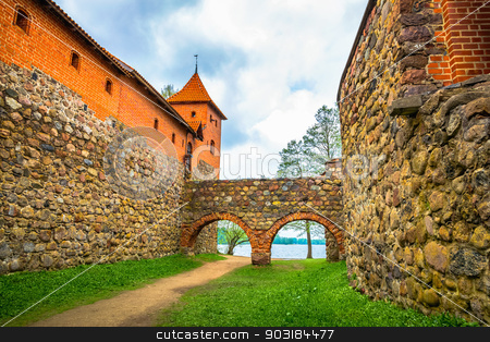 To use this stock image in your creative project, please select the size you need over to the right and click the "Add to Cart" button.
Your downloaded image will come with the Cutcaster watermark removed so don’t worry about the watermark you see on this page. Catle walls, archs and tower stock photo, View from inside of castle on stone walls, archs and red bricks tower. Trakai, Lithuania by Sergei