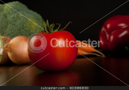 To use this stock image in your creative project, please select the size you need over to the right and click the "Add to Cart" button.
Your downloaded image will come with the Cutcaster watermark removed so don’t worry about the watermark you see on this page. tomato stock photo, tomato on black with different vegetables in the background by Felix Furo
