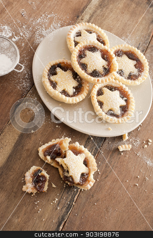 To use this stock image in your creative project, please select the size you need over to the right and click the "Add to Cart" button.
Your downloaded image will come with the Cutcaster watermark removed so don’t worry about the watermark you see on this page. Eating tasty home baked Christmas mince pies stock photo, Eating tasty home baked Christmas mince pies freshly baked in a rustic kitchen and decorated with pastry stars by Stephen Gibson