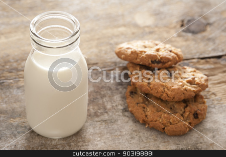To use this stock image in your creative project, please select the size you need over to the right and click the "Add to Cart" button.
Your downloaded image will come with the Cutcaster watermark removed so don’t worry about the watermark you see on this page. Fresh milk and cookies stock photo, Childhood treat of a glass bottle of fresh milk served with crunchy cookies for a delicious snack by Stephen Gibson