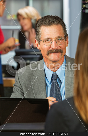 To use this stock image in your creative project, please select the size you need over to the right and click the "Add to Cart" button.
Your downloaded image will come with the Cutcaster watermark removed so don’t worry about the watermark you see on this page. Business Man Talking with Woman stock photo, Cheerful businessman with eyeglasses and mustache with woman in cafe by Scott Griessel