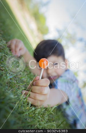 To use this stock image in your creative project, please select the size you need over to the right and click the "Add to Cart" button.
Your downloaded image will come with the Cutcaster watermark removed so don’t worry about the watermark you see on this page. Young Boy Enjoying His Lollipop Outdoors Laying on Grass stock photo, Handsome Young Boy Enjoying His Lollipop Outdoors on the Grass. by Andy Dean