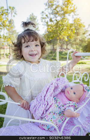 To use this stock image in your creative project, please select the size you need over to the right and click the "Add to Cart" button.
Your downloaded image will come with the Cutcaster watermark removed so don’t worry about the watermark you see on this page. Adorable Young Baby Girl Playing with Baby Doll and Carriage stock photo, Adorable Young Baby Girl Playing with Her Baby Doll and Carriage Outdoors. by Andy Dean