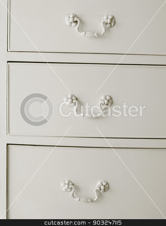 To use this stock image in your creative project, please select the size you need over to the right and click the "Add to Cart" button.
Your downloaded image will come with the Cutcaster watermark removed so don’t worry about the watermark you see on this page. White drawers with old fashioned handles stock photo, White drawers with old fashioned handles. Vertical by ABBPhoto