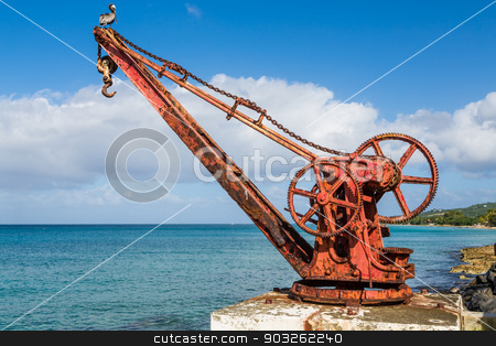 To use this stock image in your creative project, please select the size you need over to the right and click the "Add to Cart" button.
Your downloaded image will come with the Cutcaster watermark removed so don’t worry about the watermark you see on this page. Old Rusty Red Crane in St Croix stock photo, An old rusty, red crane on the island of St Croix by Darryl Brooks