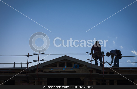 To use this stock image in your creative project, please select the size you need over to the right and click the "Add to Cart" button.
Your downloaded image will come with the Cutcaster watermark removed so don’t worry about the watermark you see on this page. Construction Workers Silhouette on Roof stock photo, Construction Workers Silhouette on Roof of Building. by Andy Dean