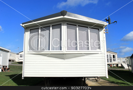To use this stock image in your creative project, please select the size you need over to the right and click the "Add to Cart" button.
Your downloaded image will come with the Cutcaster watermark removed so don’t worry about the watermark you see on this page. Caravan with a satellite dish stock photo, Closeup of a caravan with a satellite dish in trailer park. by Martin Crowdy