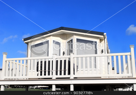 To use this stock image in your creative project, please select the size you need over to the right and click the "Add to Cart" button.
Your downloaded image will come with the Cutcaster watermark removed so don’t worry about the watermark you see on this page. Exterior of caravan on a trailer park stock photo, Exterior of caravan on a trailer park in Filey, England. by Martin Crowdy