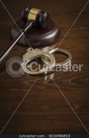 To use this stock image in your creative project, please select the size you need over to the right and click the "Add to Cart" button.
Your downloaded image will come with the Cutcaster watermark removed so don’t worry about the watermark you see on this page. Gavel and Pair of Handcuffs on Table stock photo, Gavel and Pair of Handcuffs on Wooden Table. by Andy Dean