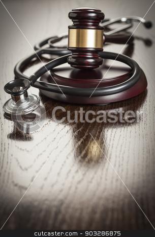 To use this stock image in your creative project, please select the size you need over to the right and click the "Add to Cart" button.
Your downloaded image will come with the Cutcaster watermark removed so don’t worry about the watermark you see on this page. Gavel and Stethoscope on Reflective Table stock photo, Gavel and Stethoscope on Reflective Wooden Table. by Andy Dean