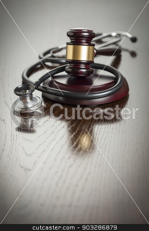 To use this stock image in your creative project, please select the size you need over to the right and click the "Add to Cart" button.
Your downloaded image will come with the Cutcaster watermark removed so don’t worry about the watermark you see on this page. Gavel and Stethoscope on Reflective Table stock photo, Gavel and Stethoscope on Reflective Wooden Table. by Andy Dean
