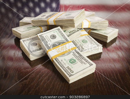 To use this stock image in your creative project, please select the size you need over to the right and click the "Add to Cart" button.
Your downloaded image will come with the Cutcaster watermark removed so don’t worry about the watermark you see on this page. Thousands of Dollars with Reflection of American Flag on Table stock photo, Thousands of Dollars Pile with Reflection of American Flag on Wooden Table. by Andy Dean