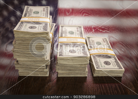 To use this stock image in your creative project, please select the size you need over to the right and click the "Add to Cart" button.
Your downloaded image will come with the Cutcaster watermark removed so don’t worry about the watermark you see on this page. Thousands of Dollars with Reflection of American Flag on Table stock photo, Thousands of Dollars Stacked with Reflection of American Flag on Wooden Table. by Andy Dean