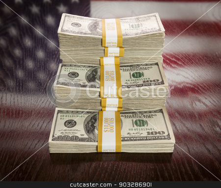 To use this stock image in your creative project, please select the size you need over to the right and click the "Add to Cart" button.
Your downloaded image will come with the Cutcaster watermark removed so don’t worry about the watermark you see on this page. Thousands of Dollars with Reflection of American Flag on Table stock photo, Thousands of Dollars Stacked with Reflection of American Flag on Wooden Table. by Andy Dean