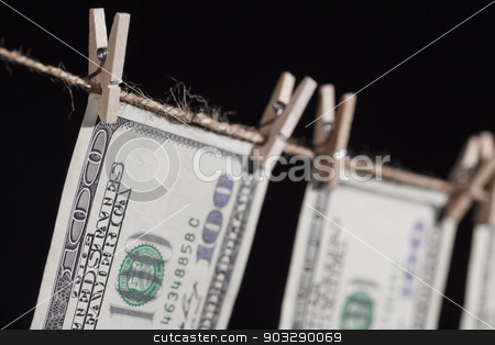 To use this stock image in your creative project, please select the size you need over to the right and click the "Add to Cart" button.
Your downloaded image will come with the Cutcaster watermark removed so don’t worry about the watermark you see on this page. Hundred Dollar Bills Hanging From Clothesline on Dark Background stock photo, Hundred Dollar Bills Hanging From a Clothesline on a Dark Background. by Andy Dean