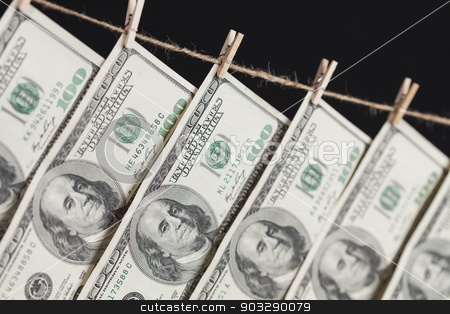 To use this stock image in your creative project, please select the size you need over to the right and click the "Add to Cart" button.
Your downloaded image will come with the Cutcaster watermark removed so don’t worry about the watermark you see on this page. Hundred Dollar Bills Hanging From Clothesline on Dark Background stock photo, Hundred Dollar Bills Hanging From a Clothesline on a Dark Background. by Andy Dean