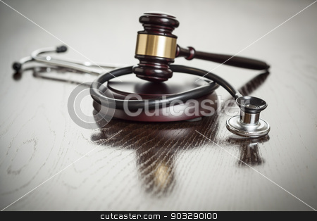 To use this stock image in your creative project, please select the size you need over to the right and click the "Add to Cart" button.
Your downloaded image will come with the Cutcaster watermark removed so don’t worry about the watermark you see on this page. Gavel and Stethoscope on Reflective Table stock photo, Gavel and Stethoscope on Reflective Wooden Table. by Andy Dean