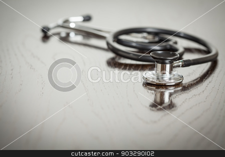 To use this stock image in your creative project, please select the size you need over to the right and click the "Add to Cart" button.
Your downloaded image will come with the Cutcaster watermark removed so don’t worry about the watermark you see on this page. Doctor Stethoscope Laying on a Reflective Table stock photo, Doctor Stethoscope Laying on a Reflective Wooden Table. by Andy Dean