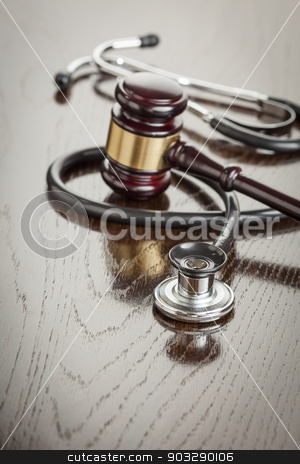 To use this stock image in your creative project, please select the size you need over to the right and click the "Add to Cart" button.
Your downloaded image will come with the Cutcaster watermark removed so don’t worry about the watermark you see on this page. Gavel and Stethoscope on Reflective Table stock photo, Gavel and Stethoscope on Reflective Wooden Table. by Andy Dean