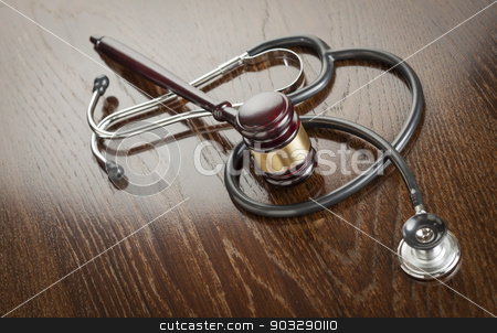To use this stock image in your creative project, please select the size you need over to the right and click the "Add to Cart" button.
Your downloaded image will come with the Cutcaster watermark removed so don’t worry about the watermark you see on this page. Gavel and Stethoscope on Reflective Table stock photo, Gavel and Stethoscope on Reflective Wooden Table. by Andy Dean