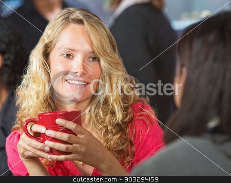 To use this stock image in your creative project, please select the size you need over to the right and click the "Add to Cart" button.
Your downloaded image will come with the Cutcaster watermark removed so don’t worry about the watermark you see on this page. Young Woman in Cafe stock photo, Beautiful young woman talking with friend in cafe by Scott Griessel