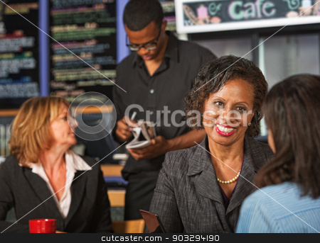 To use this stock image in your creative project, please select the size you need over to the right and click the "Add to Cart" button.
Your downloaded image will come with the Cutcaster watermark removed so don’t worry about the watermark you see on this page. Cheerful Woman in Cafe stock photo, Cheerful adult female with friend in coffee house by Scott Griessel