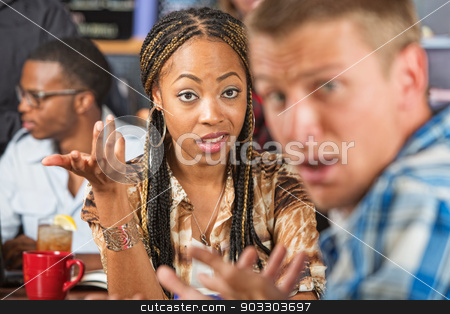 To use this stock image in your creative project, please select the size you need over to the right and click the "Add to Cart" button.
Your downloaded image will come with the Cutcaster watermark removed so don’t worry about the watermark you see on this page. Angry Woman and Confused Man stock photo, Angry woman bickering with confused man in cafe by Scott Griessel