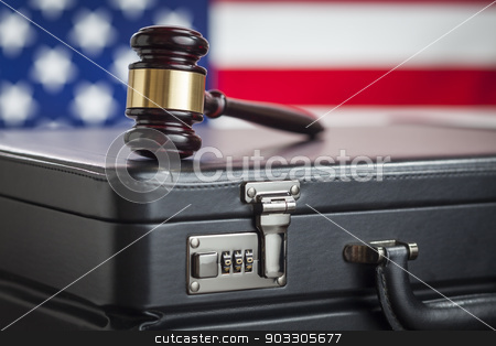 To use this stock image in your creative project, please select the size you need over to the right and click the "Add to Cart" button.
Your downloaded image will come with the Cutcaster watermark removed so don’t worry about the watermark you see on this page. Briefcase and Gavel Resting on Table with American Flag Behind stock photo, Leather Briefcase and Gavel Resting on Table with American Flag Behind. by Andy Dean