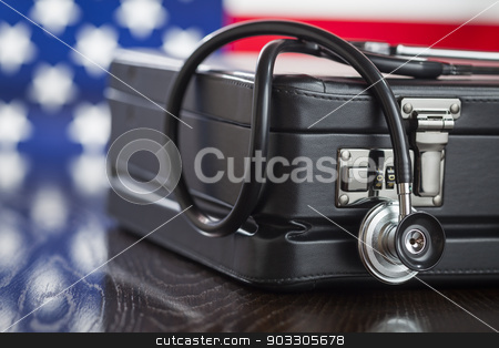 To use this stock image in your creative project, please select the size you need over to the right and click the "Add to Cart" button.
Your downloaded image will come with the Cutcaster watermark removed so don’t worry about the watermark you see on this page. Briefcase and Stethoscope Resting on Table with American Flag Be stock photo, Leather Briefcase and Stethoscope Resting on Table with American Flag Behind. by Andy Dean