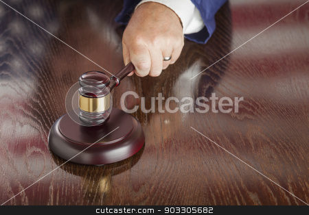To use this stock image in your creative project, please select the size you need over to the right and click the "Add to Cart" button.
Your downloaded image will come with the Cutcaster watermark removed so don’t worry about the watermark you see on this page. Judge Slams Gavel and American Flag Table Reflection stock photo, Judge Slams His Gavel and American Flag Table Reflection. by Andy Dean