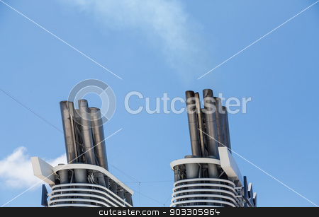 To use this stock image in your creative project, please select the size you need over to the right and click the "Add to Cart" button.
Your downloaded image will come with the Cutcaster watermark removed so don’t worry about the watermark you see on this page. Smokestacks on Cruise Ship in Blue Sky stock photo, Smokestacks on a luxury cruise ship under a clear blue sky by Darryl Brooks